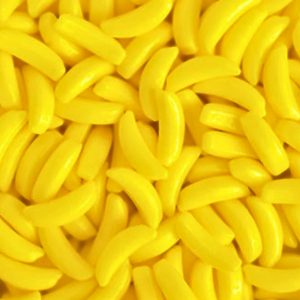 Many pieces of bright yellow Howe Company Bananarama Candy