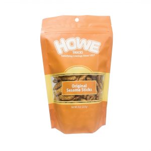 Front view of Howe Snacks Original Sesame Sticks bag, in yellowy orange