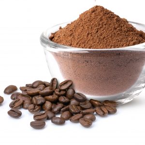 Clear bowl of George J Howe Verona Ground Coffee, with some tasty whole coffee beans next to it